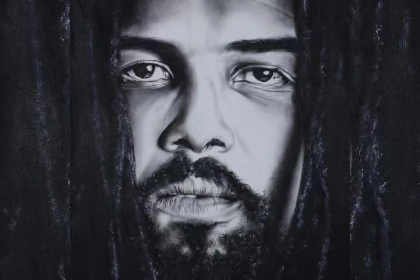 An oil painting of an African man with dreadlocks.