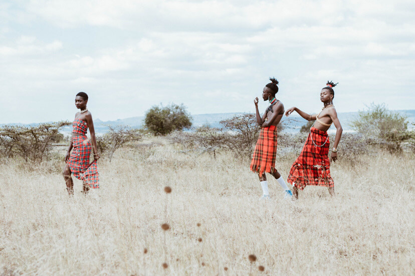 two men and one woman in the maasai, Kenya.