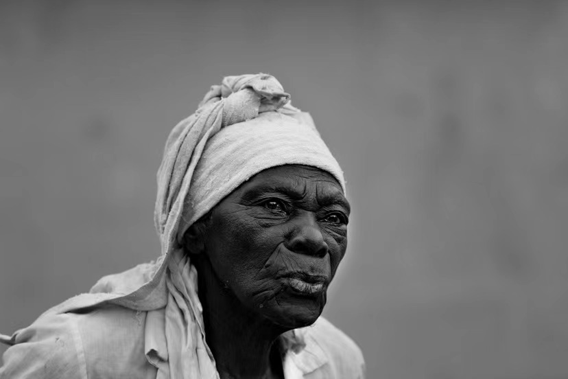 An elderly African woman.