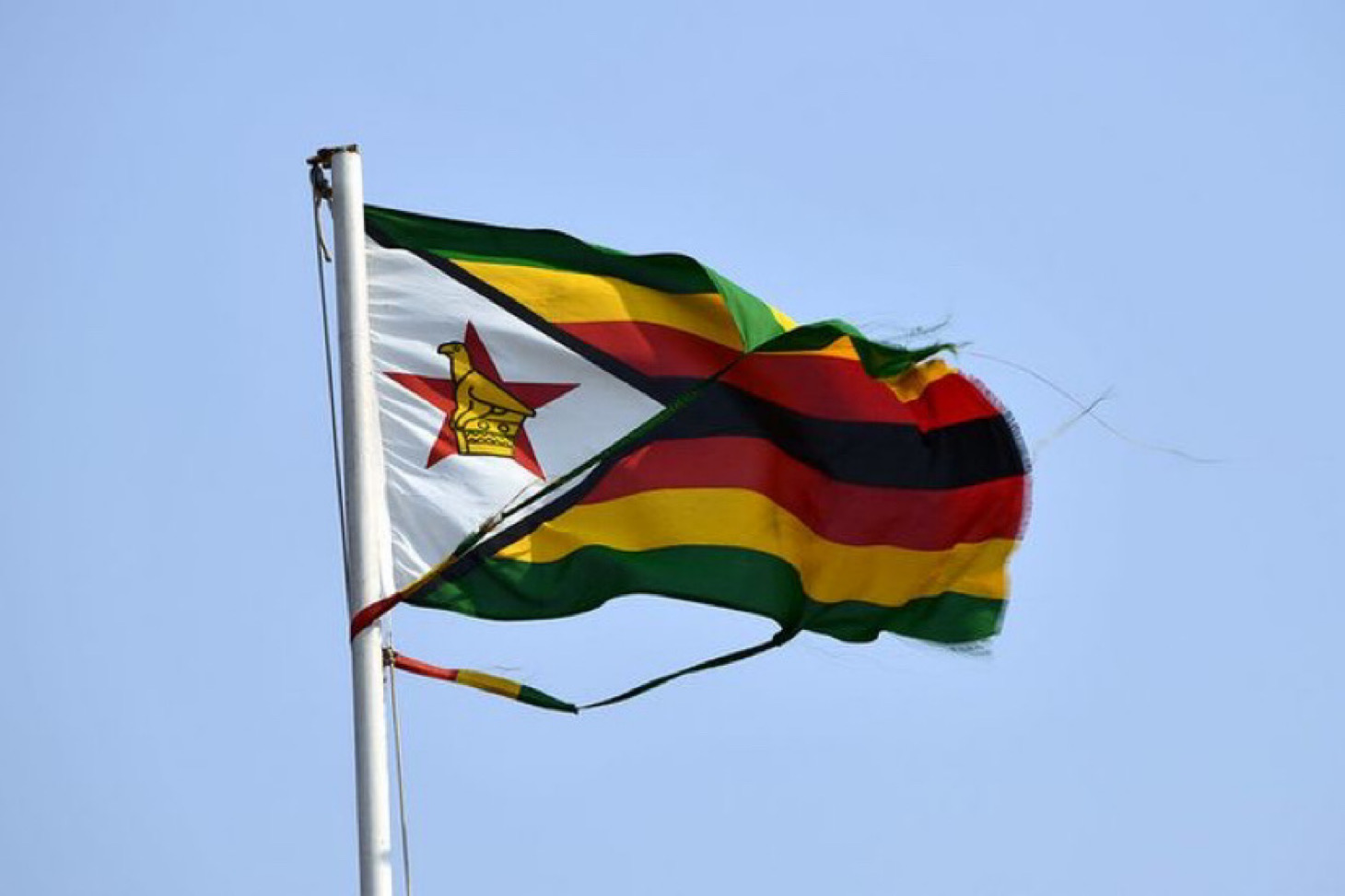 A torn Zimbabwean national flag