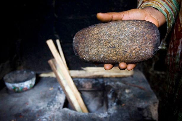 A heated stone is used for the ritual.