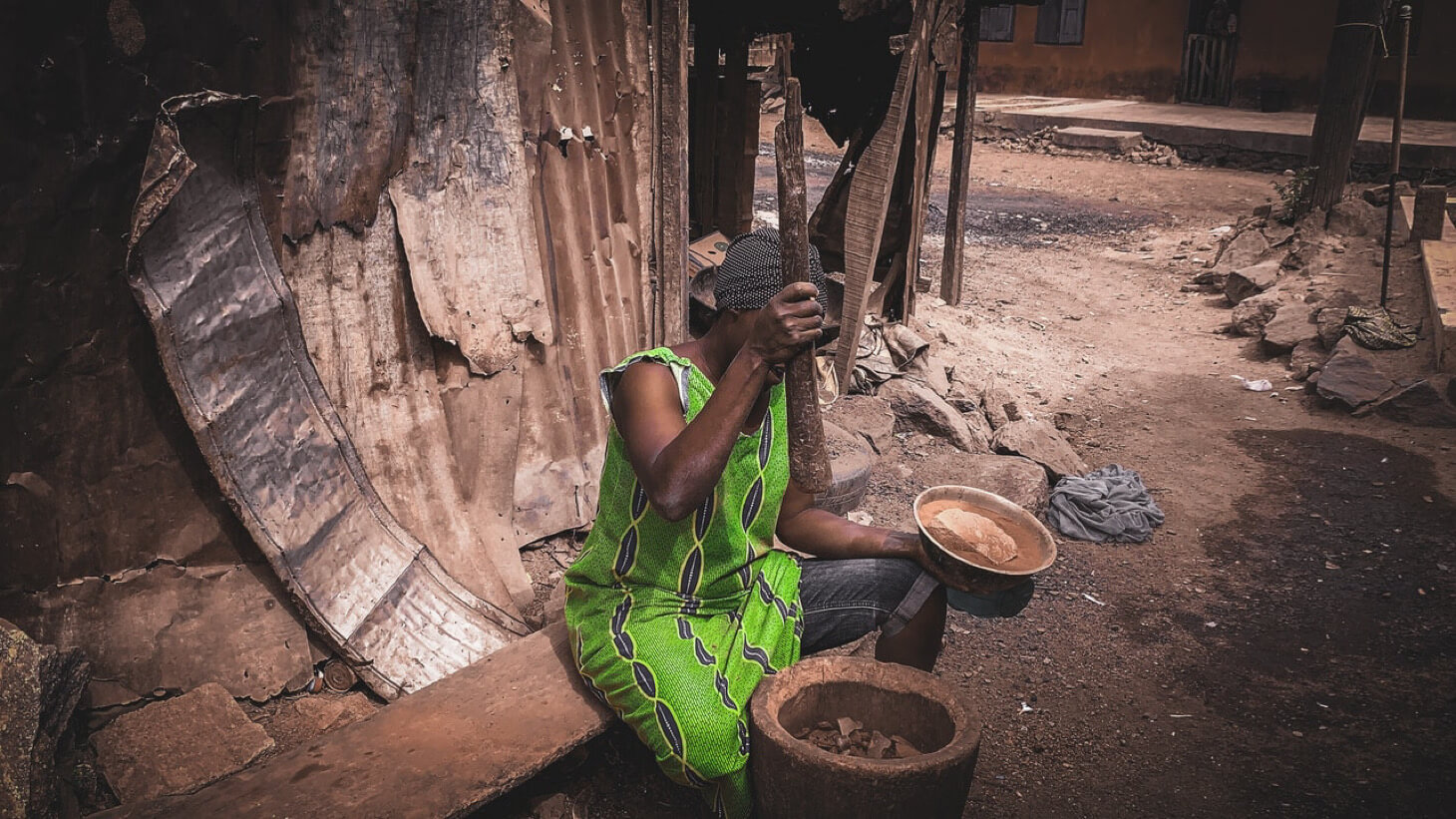 Woman pounding food